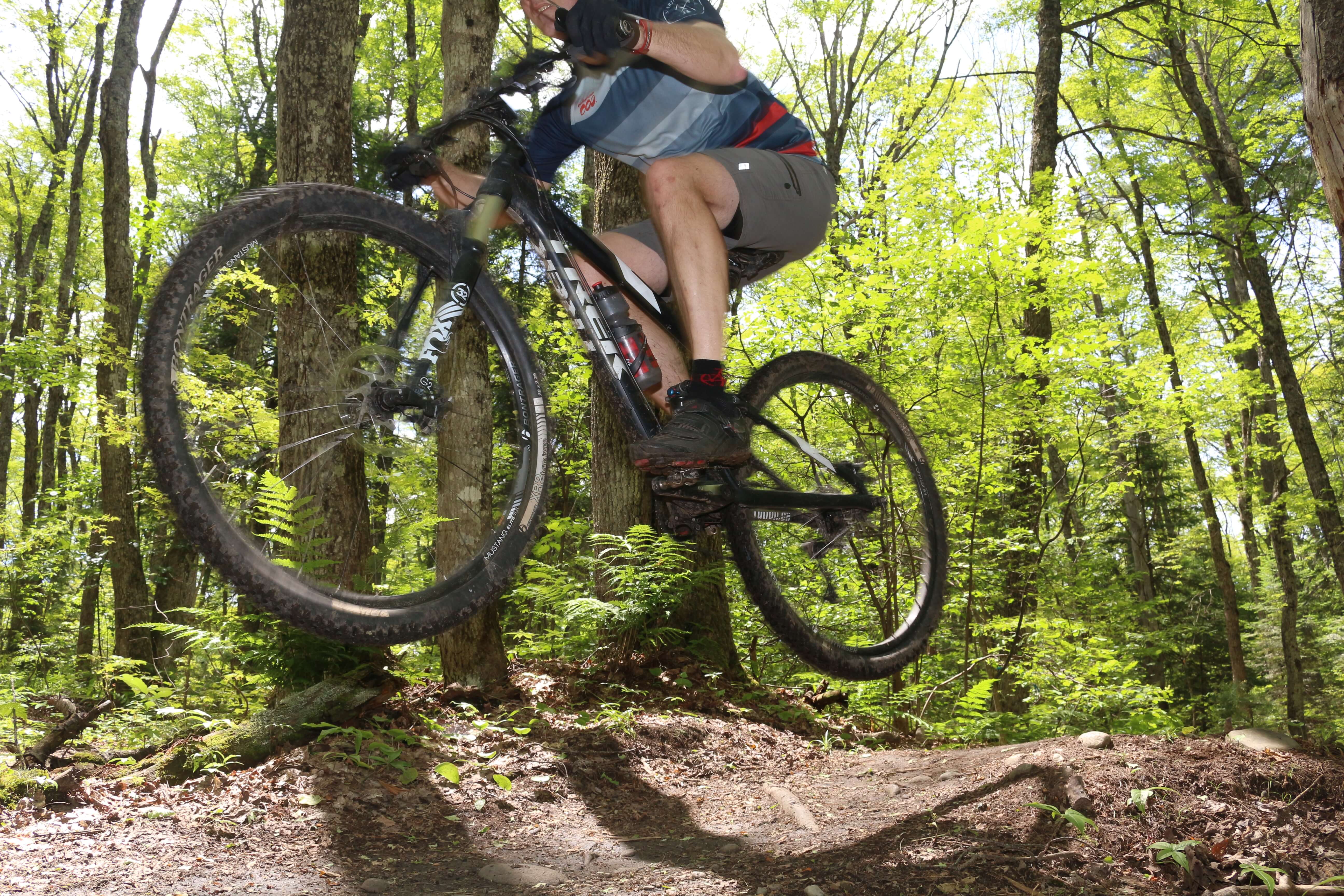 Mountain bike hovering over a trail.